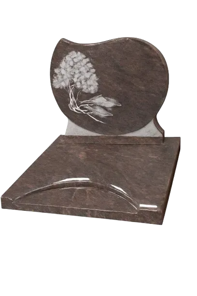 Monument funéraire en granit sombre avec stèle gravée d'un arbre fleuri blanc.