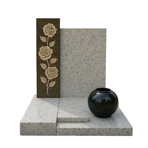 Monument cinéraire moderne en granit clair avec stèle gravée de roses.